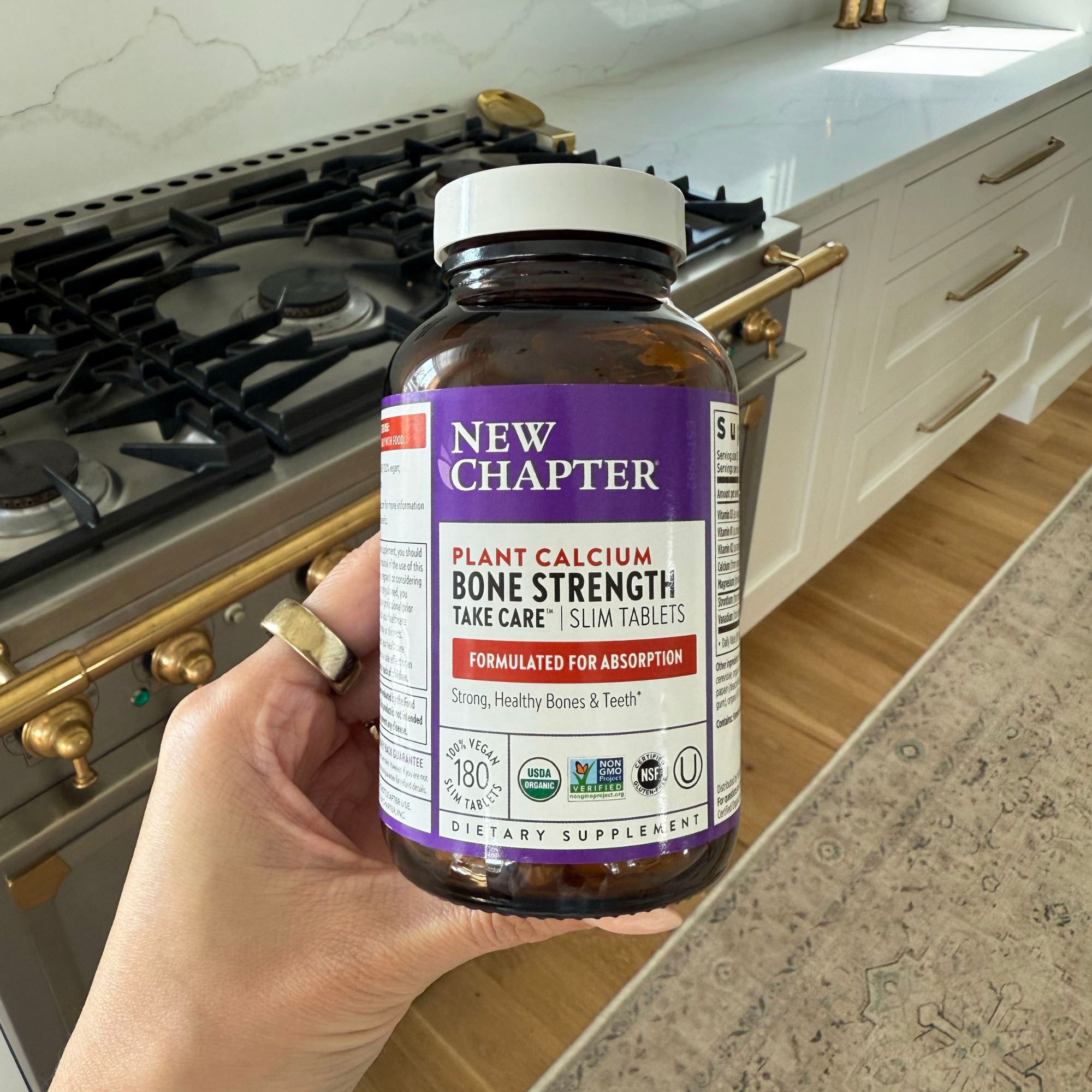 Bottle of New Chapter Bone Strength Take Care Slim Tablets